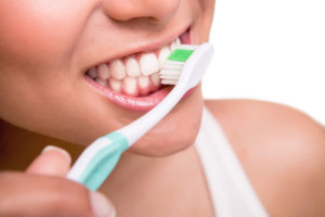 Woman holding a tooth brush